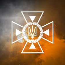 Фотографія логотип ДСНС на тлі диму та відблисків вогню
